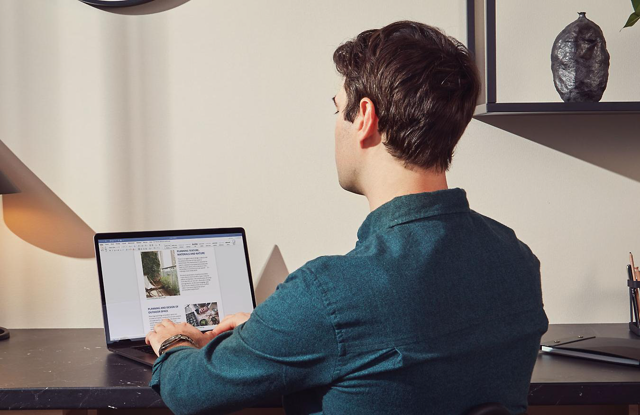 Official historical Mac promotional photograph showing Word; not a screenshot of the current complete Office suite.