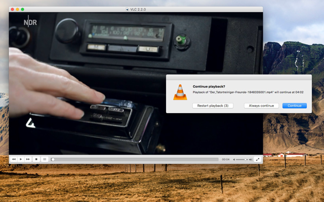 Official historical VLC 2.2.0 Mac screenshot showing video playback and the resume prompt; not VLC 3.0.24.